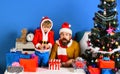 Christmas family opens presents on blue background Royalty Free Stock Photo