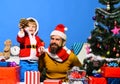 Christmas family opens presents on blue background Royalty Free Stock Photo