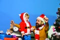 Christmas family opens presents on blue background Royalty Free Stock Photo