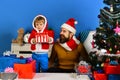 Christmas family opens presents on blue background Royalty Free Stock Photo