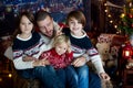 Christmas family portirat at home, father with three kids