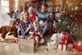 Christmas family portrait - family in front of beautiful Christmas tree