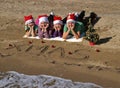 Christmas family on sand beach Royalty Free Stock Photo