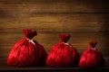 Christmas Family Santa Claus Bags, Xmas Red Sackful Wood Wall Royalty Free Stock Photo