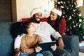 Christmas, family and tablet on sofa in home streaming movie or internet browsing. Xmas, love and girl, father and Royalty Free Stock Photo