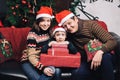 Christmas family of three persons in red hats Royalty Free Stock Photo