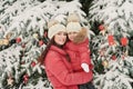 Christmas family in winter park. Happy family mother and child daughter having fun, playing at winter walk outdoors. Outdoor Royalty Free Stock Photo