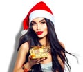 Christmas fashion model girl holding golden gift box Royalty Free Stock Photo