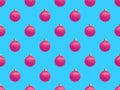 Christmas fashion seamless pattern with pink realistic balls on blue background. Royalty Free Stock Photo