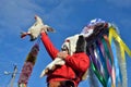 Christmas festival in romanian Orlovka Kartal village,Bessarabia. Good spirit Moshul holding a hen.He wears a mask made of rabbi