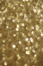 Christmas festive background. Abstract shiny gold defocused glitter bokeh Royalty Free Stock Photo