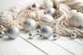 Christmas festive background with Christmas balls and knitted element.