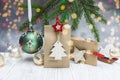 Christmas festive background with fir tree branch and paper gift