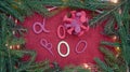 On a Christmas festive background, there are letters, symbols of different strains of coronavirus. Coronavirus figure