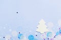 Christmas festive banner background: white christmas tree and confetti with sparkling glitter and stars. Royalty Free Stock Photo