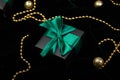 Christmas festive black gift boxes with green ribbon