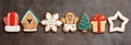 Christmas festive border gingerbread on a dark rustic grunge background. Top view, flat lay Royalty Free Stock Photo