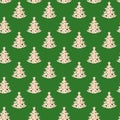 Christmas festive creative seamless pattern of carved wooden christmas trees on green background.