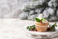 Christmas festive cupcake with holly leaves