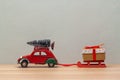 Christmas red toy car with sledges gift fir-tree