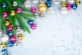 Christmas festive frame, New Year decorative border, gold, silver, pink balls decorations, green fir branches on blue Royalty Free Stock Photo