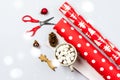 Christmas Festive Mood Flat Lay Hot Chocolate with Marshmallows Christmas Decorations Cone and Red Scissors Christmas Gift Paper Royalty Free Stock Photo