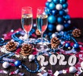 Christmas, festive mood: glass of champagne and New Year`s 2020 decoration Royalty Free Stock Photo