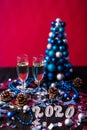 Christmas, festive mood: glass of champagne and New Year`s 2020 decoration Royalty Free Stock Photo