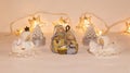 Christmas festive scenery showing the Holy Family with 2 handcrafted angel ornaments in warm golden light; Royalty Free Stock Photo
