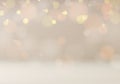 Christmas festive shimmering blurred golden glitter and light bokeh on beige background luxury style Royalty Free Stock Photo