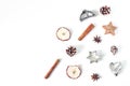 Christmas festive styled food composition, pattern. Pine cones, dried apple fruit, cinnamon, vintage cookie cutters and