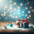 Christmas festivities, New Year, a table, a hat, a box and a snowman, lights, snow and gifts on a wooden table. Royalty Free Stock Photo