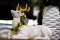 Christmas figurine of a white deer. Shallow depth of field