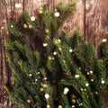 Christmas fir branches on wooden background. Xmas and New Year holiday. Flat lay, top view Royalty Free Stock Photo