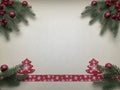 Christmas fir with red decors on it and red ribbon