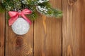 Christmas fir tree and bauble with red ribbon Royalty Free Stock Photo