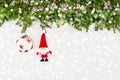 Christmas fir tree branch with Santa and decoration on white wooden background. Copy space Royalty Free Stock Photo