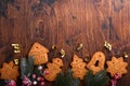 Christmas fir tree branches, Christmas balls, Christmas gingerbread, gift box, wooden snowflakes and stars on old wooden Royalty Free Stock Photo