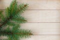 Christmas tree branches on a wooden striped background, good for Christmas background Royalty Free Stock Photo