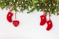 Christmas fir tree, Christmas socks on white wooden board background. Top view, copy space Royalty Free Stock Photo