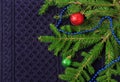 Christmas fir tree with decoration on dark blue knitted wool background Royalty Free Stock Photo