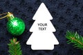 Christmas fir tree with decoration on dark blue knitted wool background Royalty Free Stock Photo