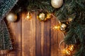 Christmas fir tree with decoration on dark wooden board Royalty Free Stock Photo