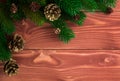 Christmas fir tree with decoration on dark wooden board. Soft focus. Royalty Free Stock Photo