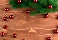 Christmas fir tree with decoration on dark wooden board. Soft focus. Royalty Free Stock Photo