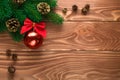 Christmas fir tree with decoration on dark wooden board. Soft focus. Royalty Free Stock Photo