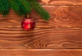 Christmas fir tree with decoration on dark wooden board. Soft focus. Royalty Free Stock Photo