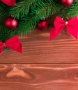 Christmas fir tree with decoration on dark wooden board. Soft focus. Royalty Free Stock Photo