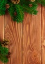 Christmas fir tree with decoration on dark wooden board. Soft focus. Royalty Free Stock Photo