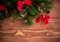 Christmas fir tree with decoration on dark wooden board. Soft focus. Royalty Free Stock Photo